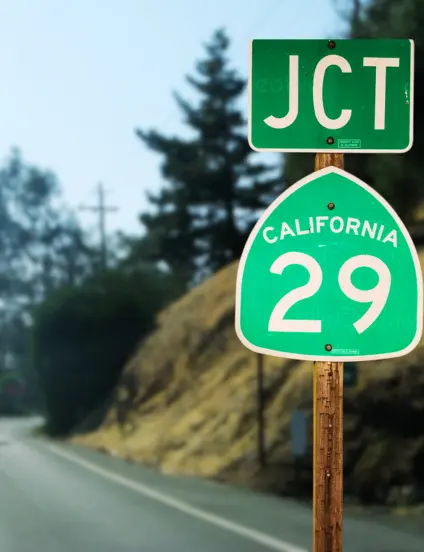 Highway 29 road sign in Vallejo, California, surrounded by trees and hills — a well-known route near Vallejo Relief Center dispensary.