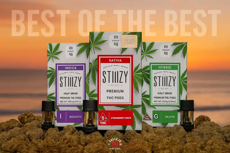 blog-hero-image-best-stiiizy-products-2025 STIIIZY premium THC pods – Biscotti (Indica), Strawberry Cough (Sativa), and Gelato (Hybrid) – displayed on a bed of cannabis flower with a sunset background and the words ‘Best of the Best’ above. Featured by Vallejo Relief Center.