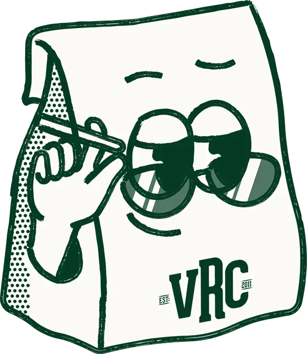 baggie-mascot-600px Cartoon-style illustration of a paper bag character wearing sunglasses and holding a lit joint, with a relaxed facial expression. The letters "VRC" and "EST. 2011" are printed on the front of the bag in bold lettering. Vallejo Relief Center Mascot.