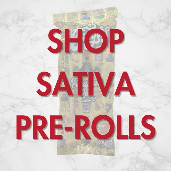 Sativa pre-roll ad with colorful cannabis packaging and ‘Shop Sativa Pre-Rolls’ text overlay on marble background — Vallejo Relief Center promo image.