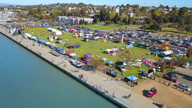 Aerial view of Vallejo Waterfront Weekend with tents, food vendors, and activities along the shoreline.