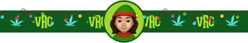 Cartoon image of VRC budtender DaVinci dressed as a Christmas elf, smiling with rosy cheeks, set against a green VRC holiday-themed background with colorful string lights and cannabis leaf designs.