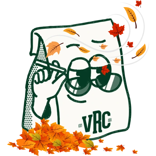 VRC's Mascot, Baggie, wearing sunglasses with autumn leaves blowing in the wind and a pile of autumn leaves on the ground, symbolizing the arrival of Fall