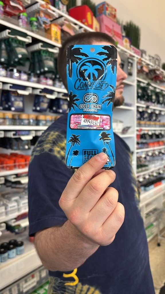 Budtender holding Connected’s Cherry Marker Cold Chain Live Resin Cartridge as one of the budtenders' pick for JUne.