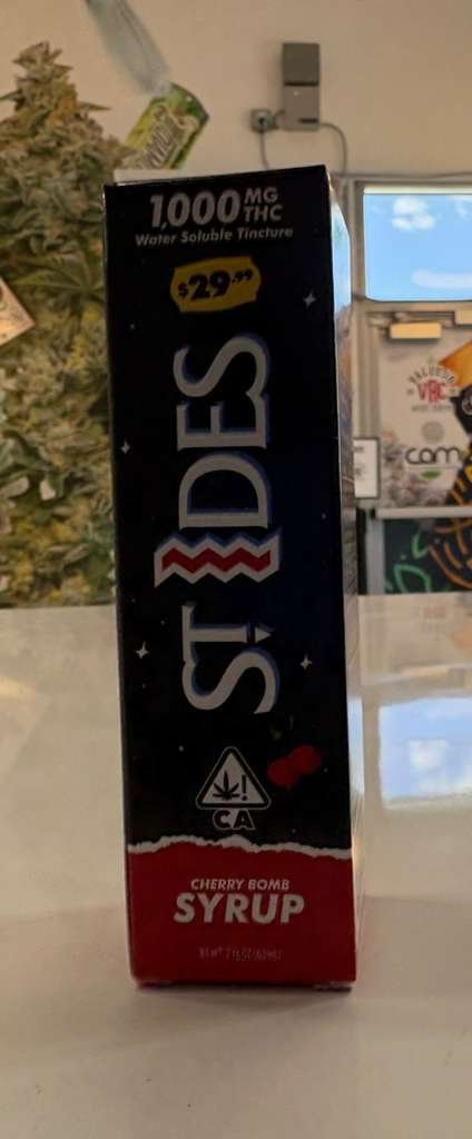 St. Ides Cherry Bomb Syrup bottle with bold cherry-themed labeling and vibrant red packaging design as one of the budtenders' picks for June