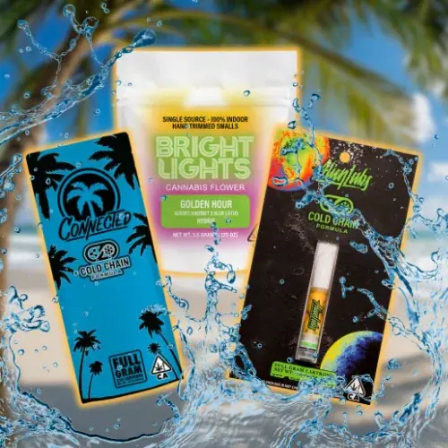 homepage-specials-slider-brightlights-connected-alien-labs-mondays-2 Cannabis product display featuring Bright Lights Golden Hour flower, Connected Cold Chain cartridge, and Alien Labs Cold Fire vape, styled with tropical background and splashing water effects.