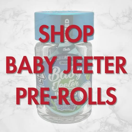 landing-page-shop-baby-jeeter-2 Baby Jeeter Blueberry Kush pre-roll jar with red text reading “Shop Baby Jeeter Pre-Rolls” over a light marble background.